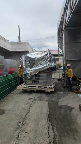 Truck unloading materials near building