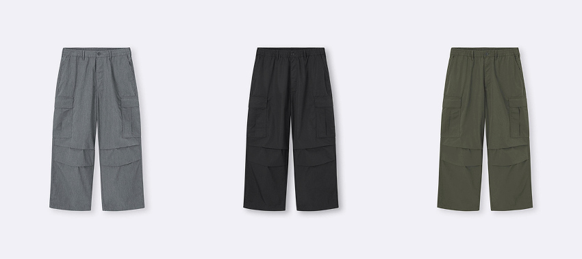 三條工裝褲並排展示,顏色分別為灰色、黑色和墨綠色。白色背景突顯褲子顏色及口袋設計,風格簡約