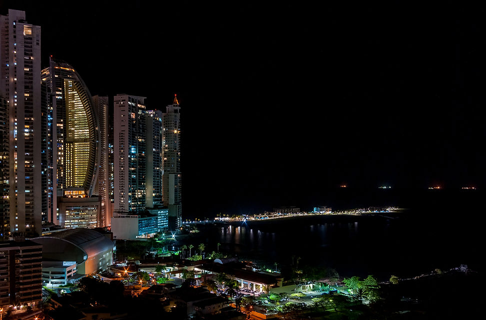 Punta Pacífica towers lit up at night on the Bay of Panama