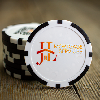 Custom poker chip golf ball marker with JL Mortgage Services branding.