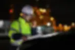 Workers wearing high visibility clothing with reflective elements ensuring visibility in active worksite