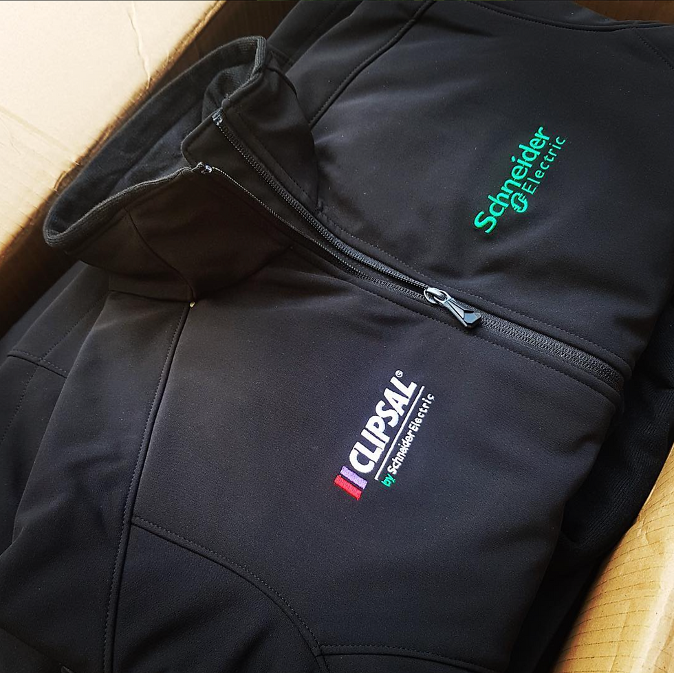 High angle view of a delivery box filled with neatly folded custom uniforms