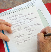 Seniors making notes at emergency preparedness workshop