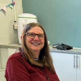 Smiling woman in maroon sweater