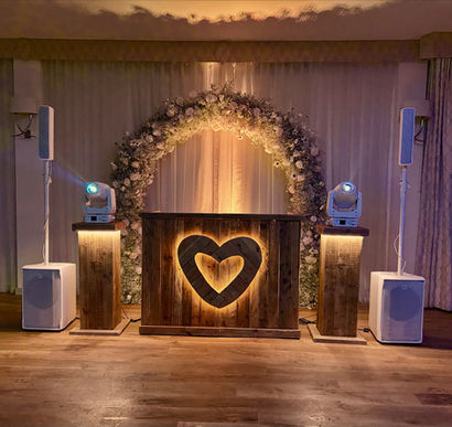 the woodnorton hotel, wedding venue, rustic dj setup, podium lights, flower arch, wedding dj