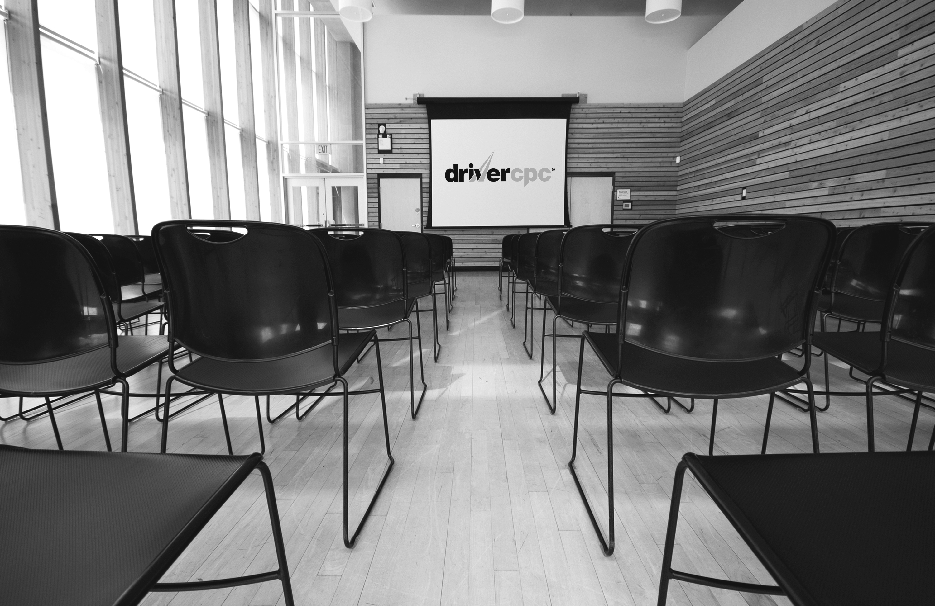 chairs-and-projection-screen-in-empty-room-2023-11-27-05-01-58-utc_edited.jpg