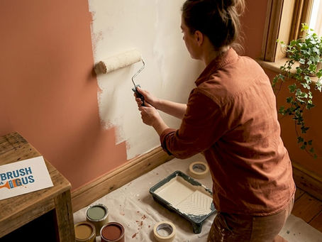 Homeowner painting living room limewash wall