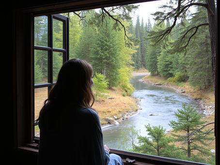 woman looking out window reflecting on life