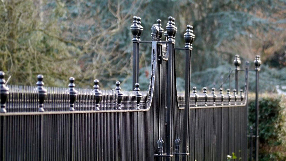 Black outdoor railings for a garden.