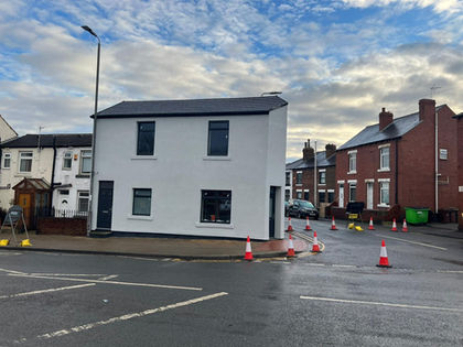 A house with a road in front.