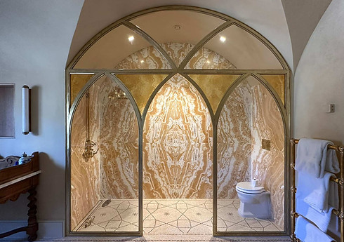 A gothic style shower screen fabricated by Stokes Welding.