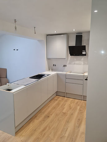 A newly installed kitchen, with white counters.
