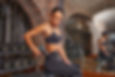 A promotional photo of a woman in a gym