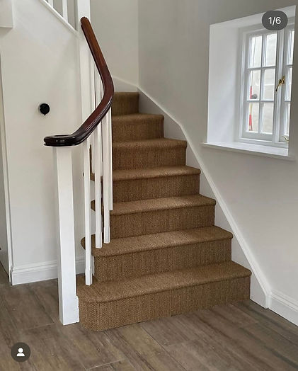 A staircase with carpeting.