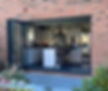 A modern kitchen with bi-folding garden doors.