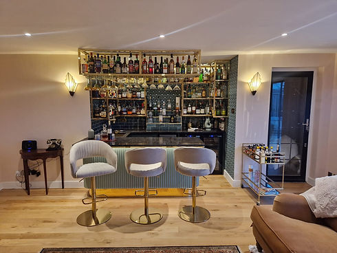 A home bar with stools and a bar counter