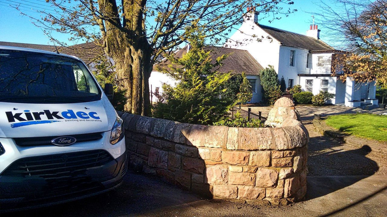Kirkdec Patining & Decorating van parked outside a house in Strathaven. Exterior masonry painting