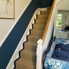 A staircase with natural flooring