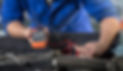 A mechanic diagnosing a vehicle
