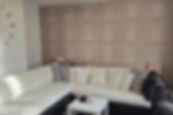 A renovated living room with a sofa
