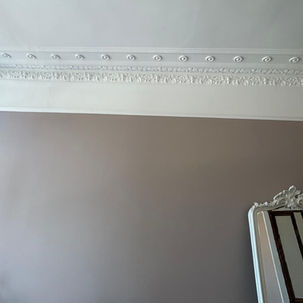 A wall painted with brown paint.