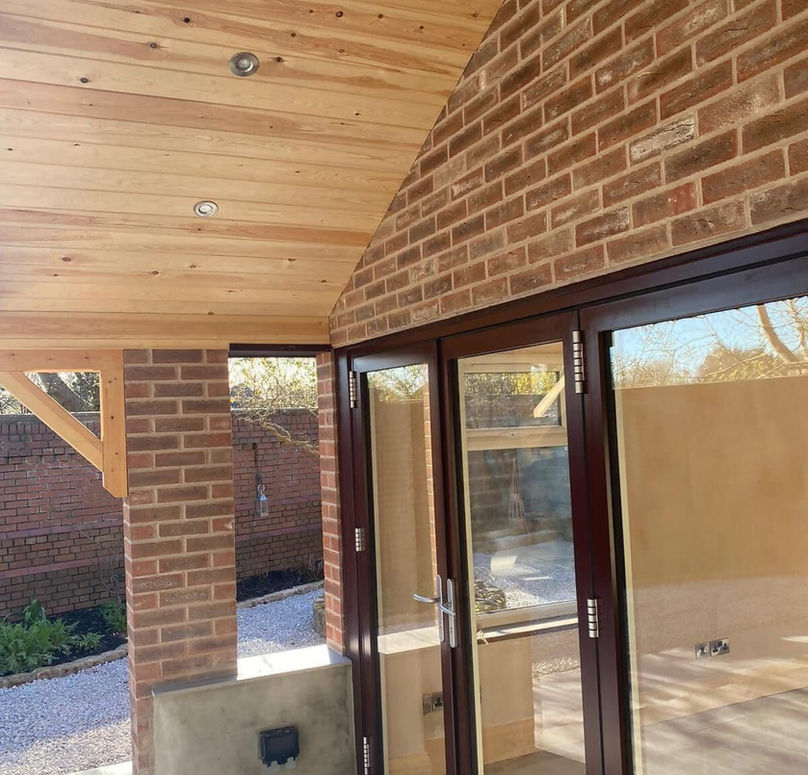 The exterior of a property with modern doors. 