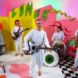 A colourful music themed set with a band playing instruments