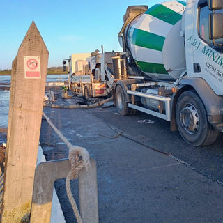 A vehicle for A B J Minimix on a construction project.