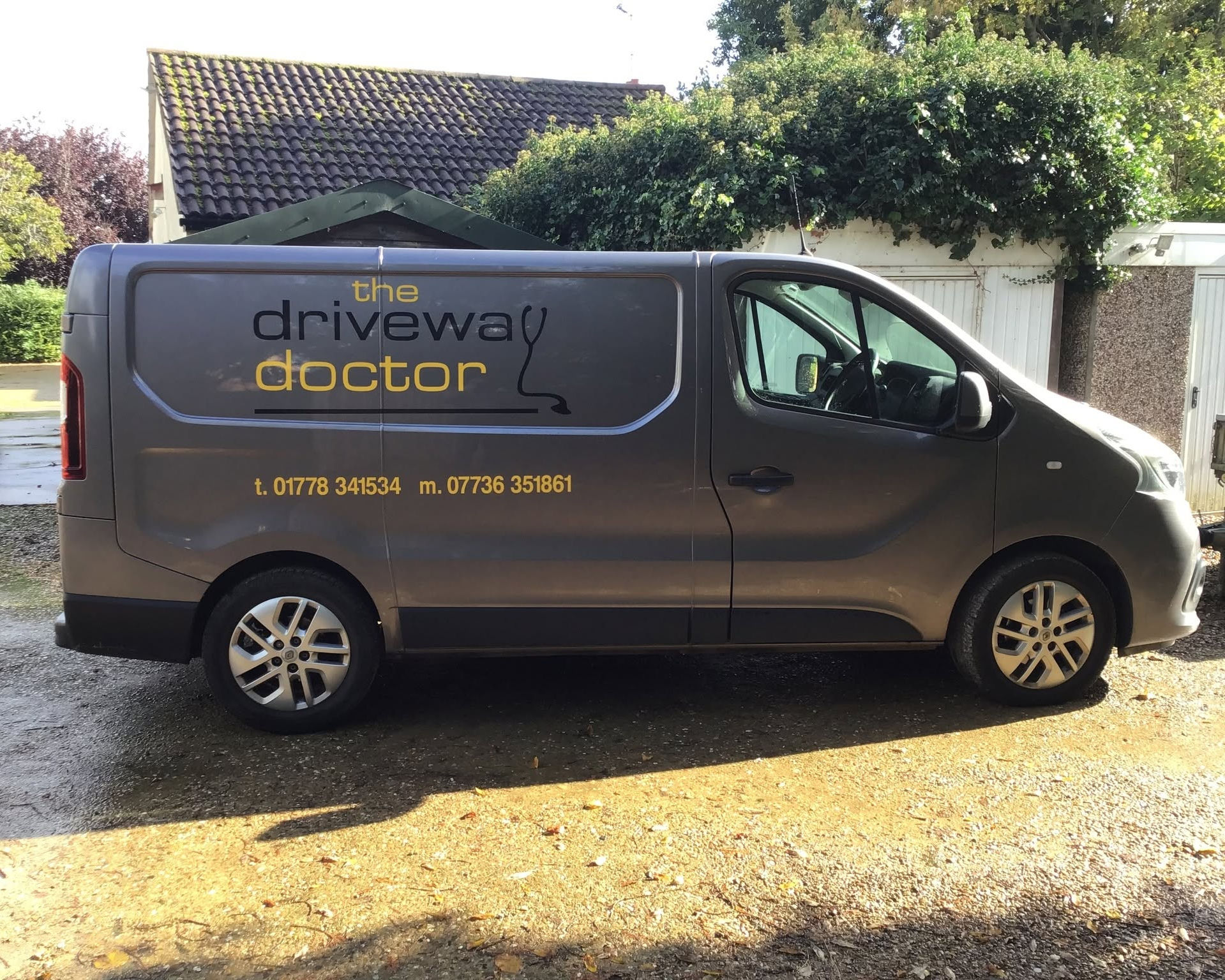 The Driveway Doctor van parked outside a house