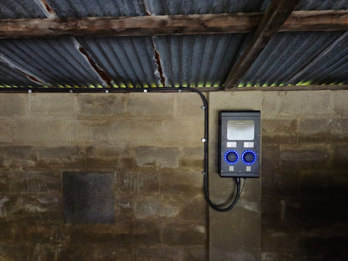 An EV charger installed in a garage. 
