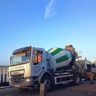 An A B J Minimix vehicle supplying concrete.