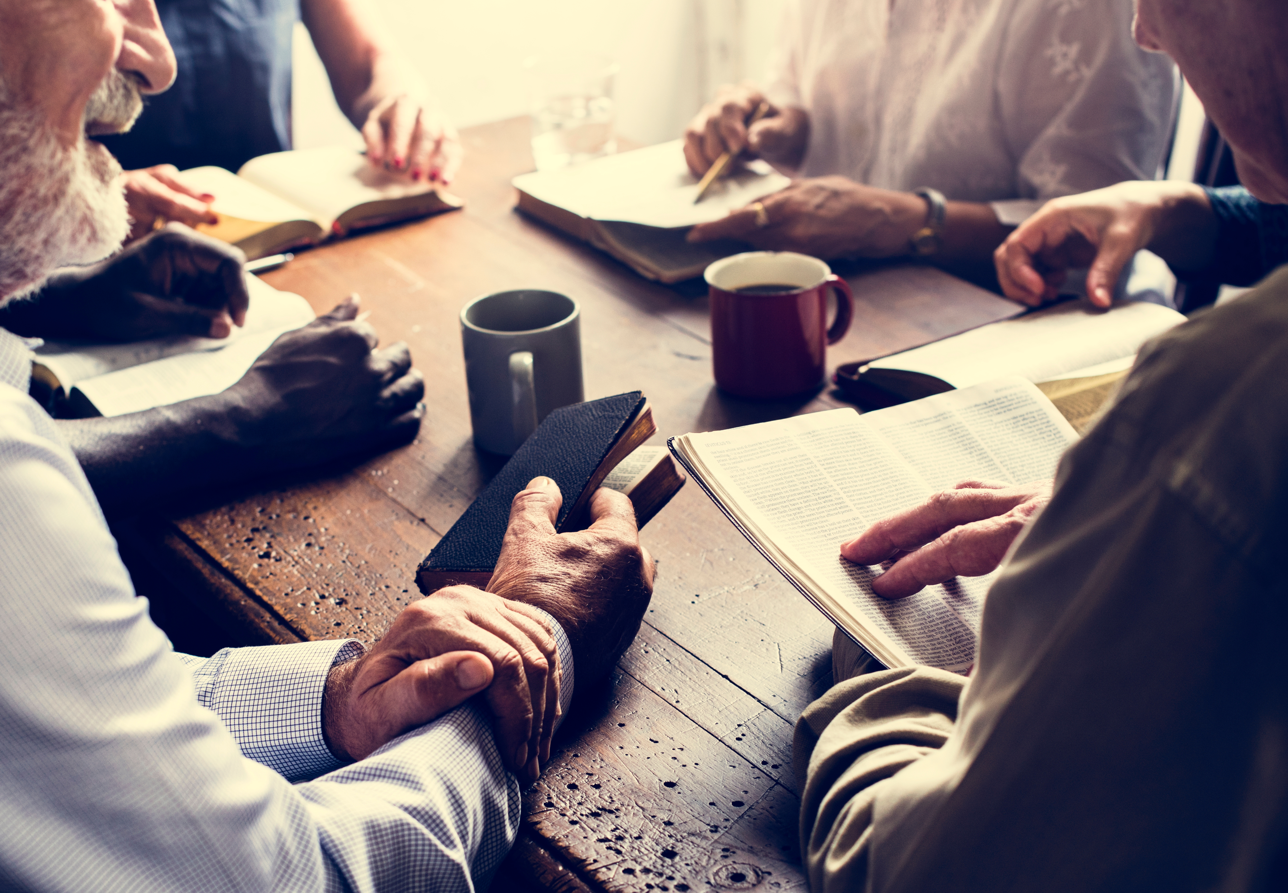 Group of people studying the Bible.