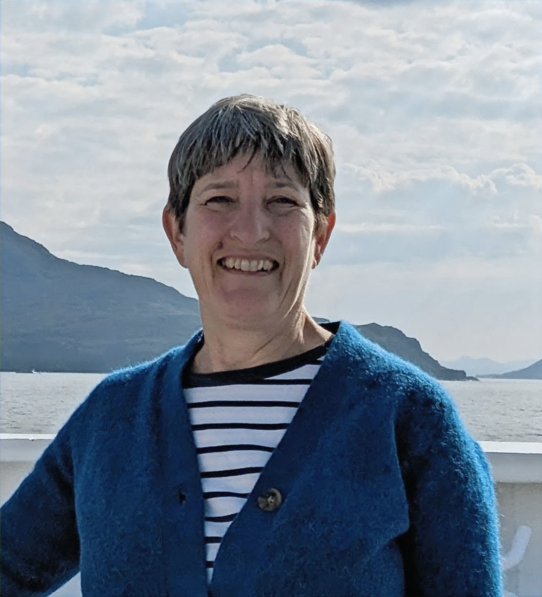 A photograph of a women with short brown hair