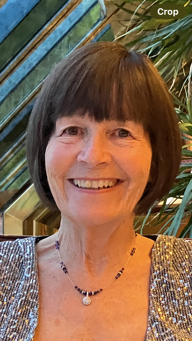 A photograph of a women with short brown hair