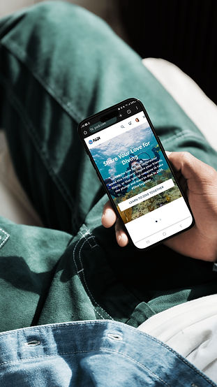 Person holding a phone with a webpage displayed; nature and landscape scenes.