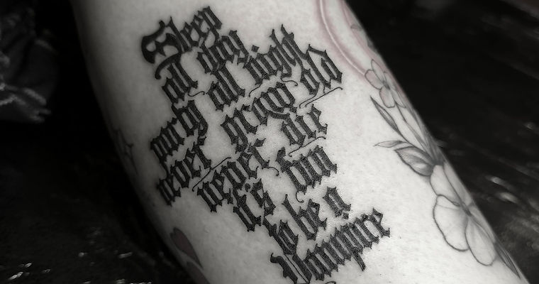 Script lettering tattoo by Sixty Ink London.