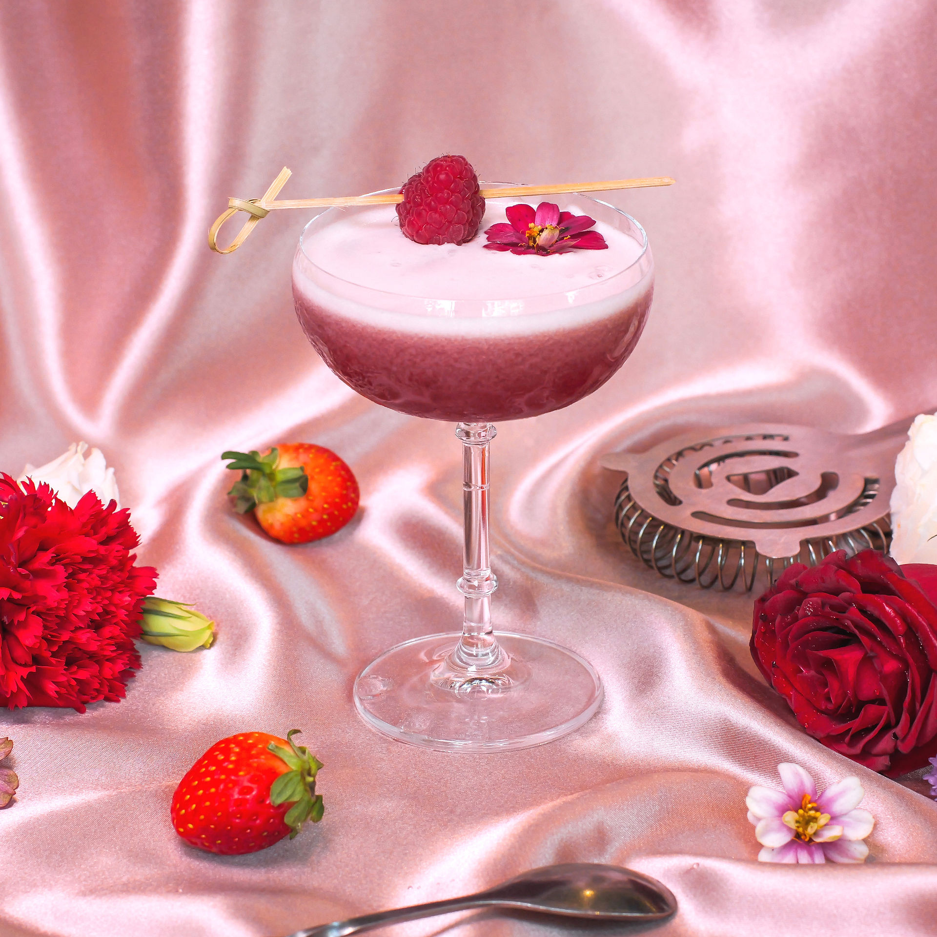 Rouge Romance - Cocktail on pink silk surrounded by roses, flowers and fresh berries