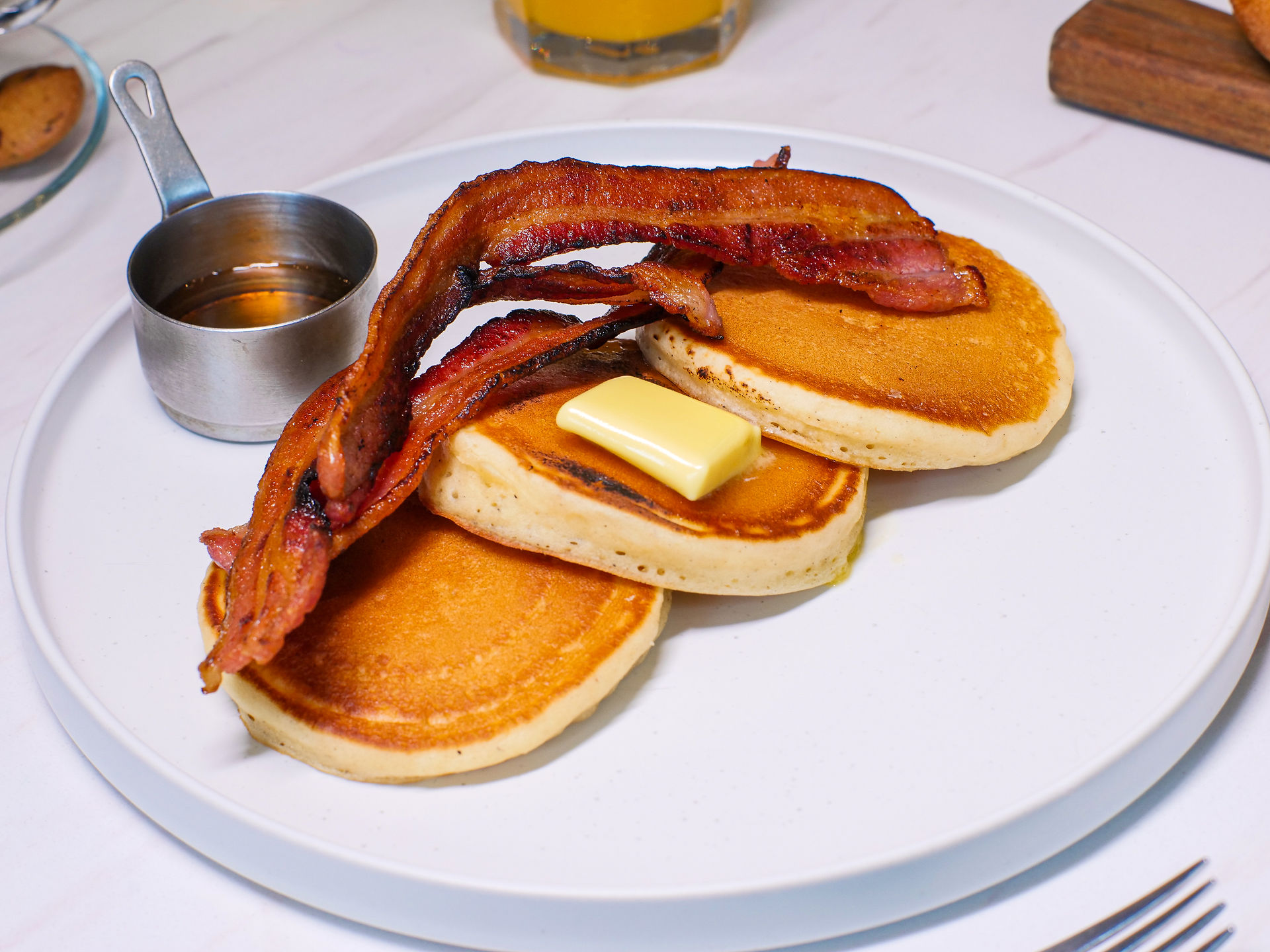 Pancakes & Bacon - Served with premium butter and maple syrup