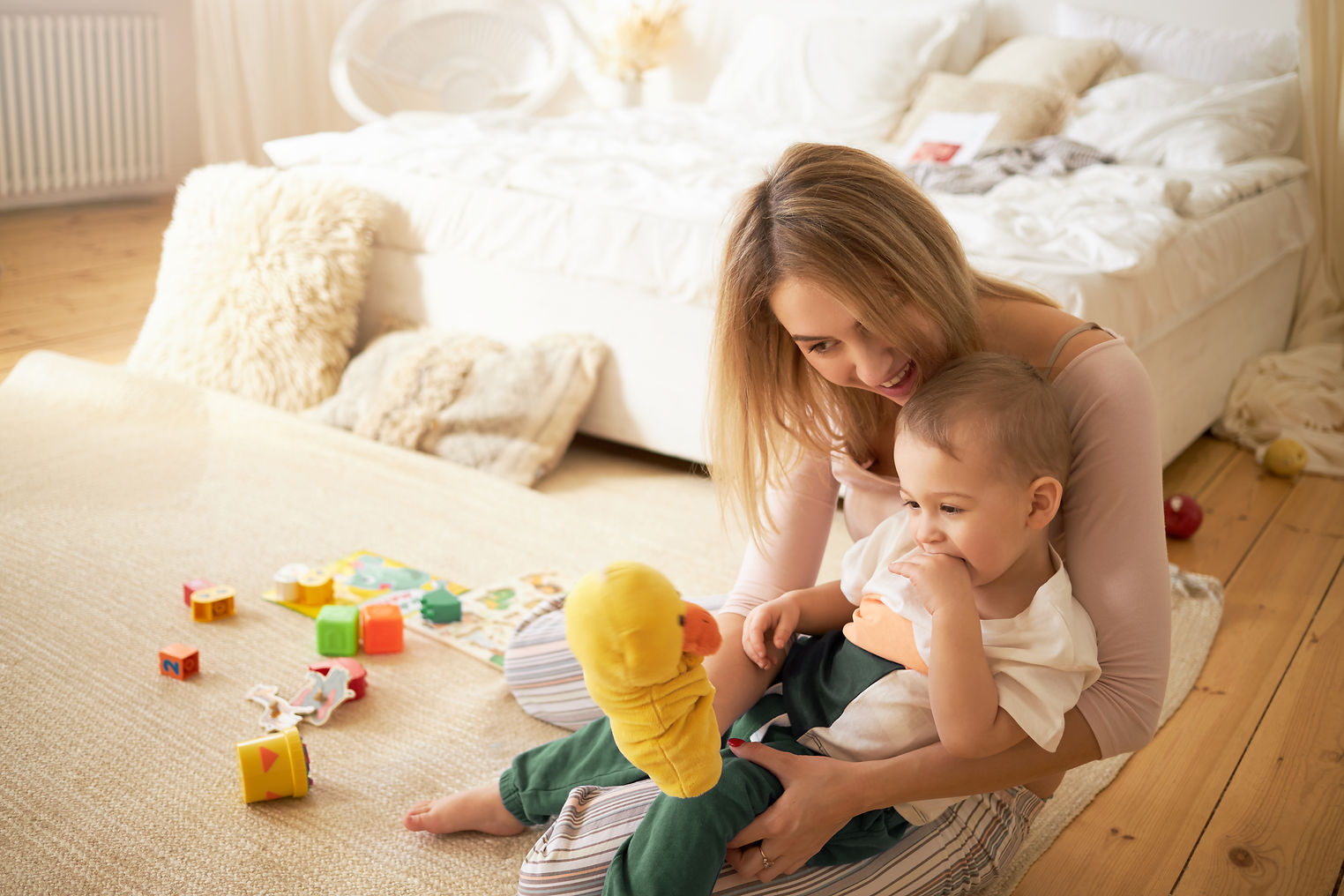 happy-young-mother-playing-cute-little-child-playing-floor-blonde-female-babysitting-adora