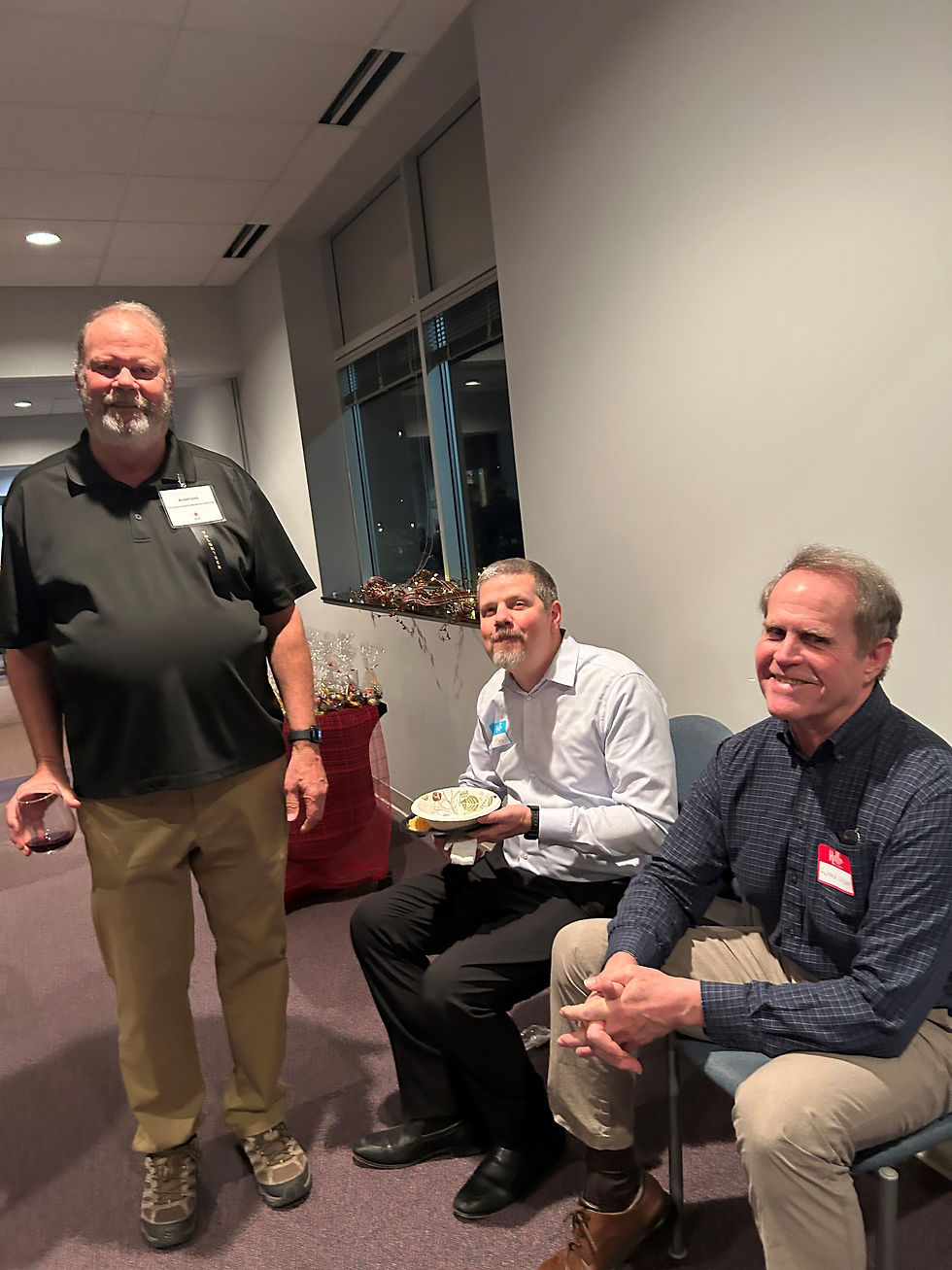 Attendees at the Des Moines event enjoying food and conversation