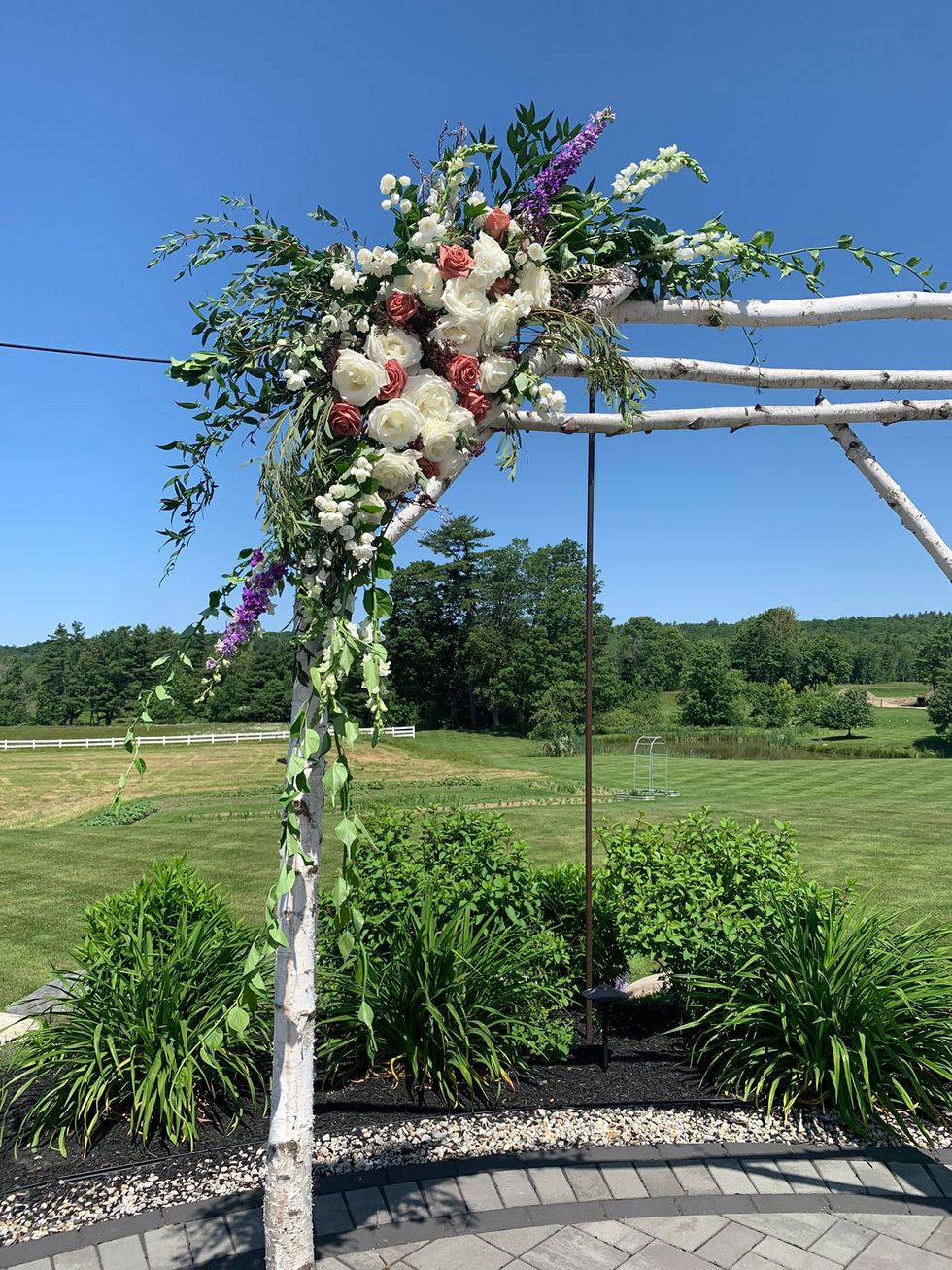 arbor spray with snaps, mock orange, delphinium, tibet roses, barista roses, greens