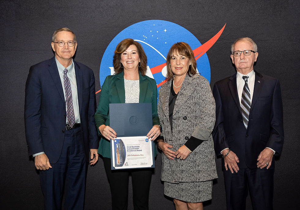 John Cannady, Sherrie Nash, Melanie Newton and David Brock display Marshall Spaceflight Center Subcontractor Excellence Award at Industry and Advocates Award Ceremony.