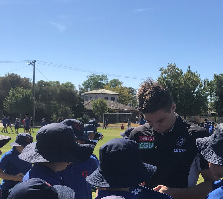 Magpie players come to Guthrie Street