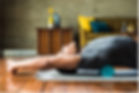 Man stretching over foam roller