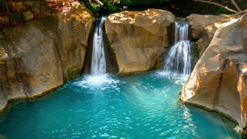 Stunning turquoise waterfall in the Guanacaste jungle near Playa Grande Costa Rica vacation rentals.