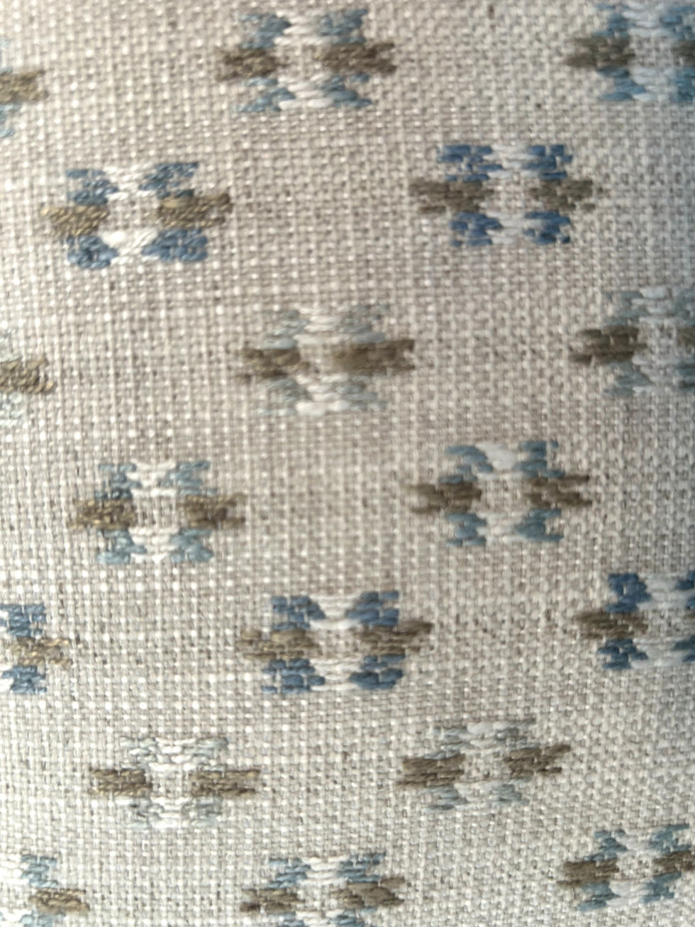 The Dobby Print Pillow Cover in Blue, Light Brown and Cream on a Natural Tone Background adds an easy, lived-in elegance with