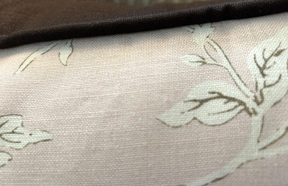 Thumbnail: The Pink Floral Linen Throw Pillow showcases large stylized flowers intertwined with delicate stems on a blush pink linen bac