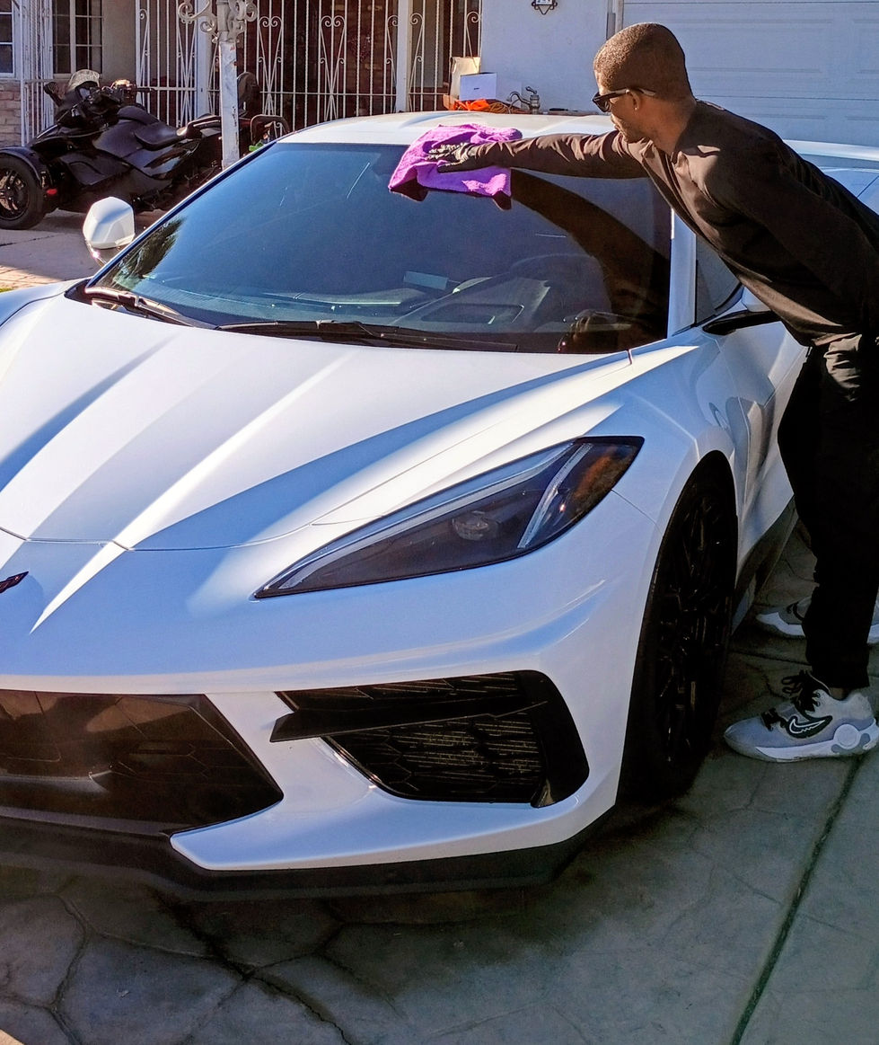 "Mobile car detailing service hand-drying a white Chevrolet Corvette C8 in El Centro, CA — 274 Car Wash on the Spot."