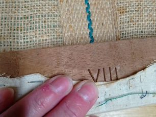 Roman numerals on handmade chair seats
