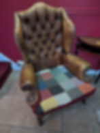 Bespoke handcrafted fabric seat cushion for a classic wingback chair restoration project in Dorset.